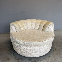 Sofa Ottoman .Vintage armchair with leopard print and ottoman, made in the style of the mid-century or the Hollywood Regency