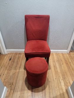 Chair with a footstool and storage.
