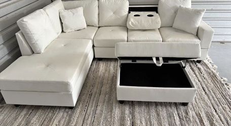 Rocket White Reversible Sectional with Cup Holder and Storage Ottoman. Brand New .