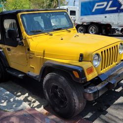 2000 jeep wrangler tj sport4x4  4.0 6 cyl 5 speed NEW REBUILT COMPLET ENGINE O MILES ,new starter,new clutch and transmission parts ,new back half Exh