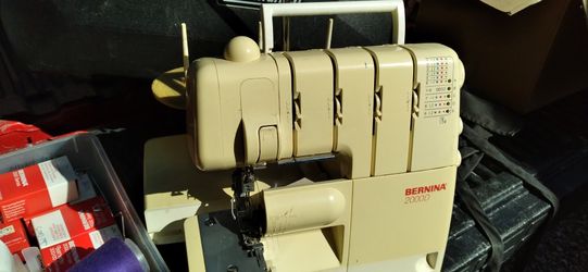 "Surger"Sewing Machine. Over $ 300.00 Worth Of Attachments! .I Think Its For A More Experienced Sewer. But Iit Comes W/ Books Ect.