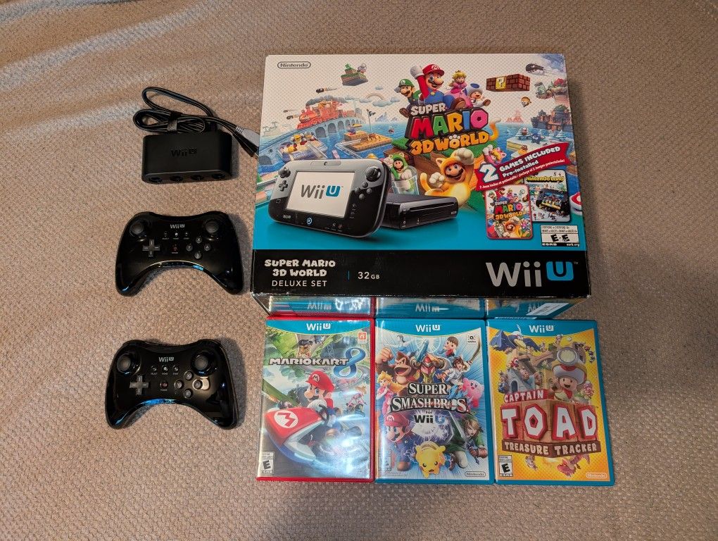 Nintendo Wii U complete in box, with 2 controllers, 3 games, and Gamecube adapter