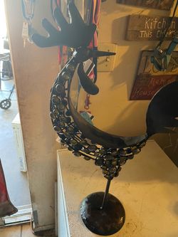 rooster. Made a metal and has gems  throughout the body. Check out the pictures will fit in anybody's living area. It's very unique vintage. Pick up o