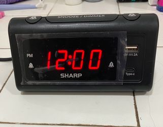 Alarm clock with built in phone usb outlets to charge phone