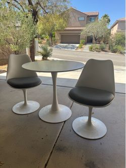 White table with 2 swivel chairs