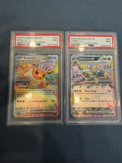 2025 Pokémon Prismatic Evolutions Surprise Box Exclusive promos, both graded PSA 9 Mint.