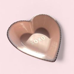 Pink heart shaped ceramic dish with white XOXO letters