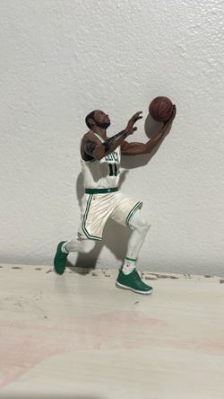 This image shows a McFarlane Toys NBA 2K19 Series 1 Kyrie Irving action figure