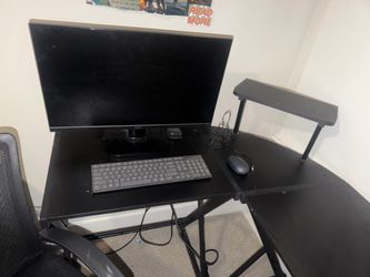 Desk, chair, keyboard and monitor