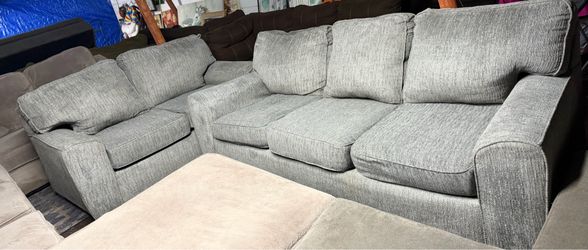 Gray couch and love seat good condition clean we sell all the time delivery 40 local