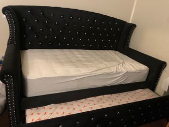 Black upholstered daybed sofa with rhinestone studs