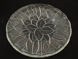 Vintage pressed clear glass cake and chop plate with an embossed floral leaf pattern. 12.5”