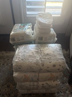 12 Packages Of Newborn Diapers!