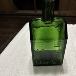 Vintage EC Booz’s old cabin green bottle