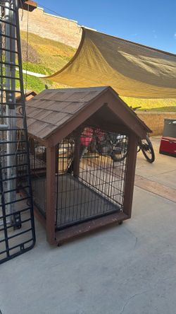 Dog cages on wheels with shade / rain cover.