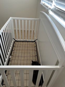 White crib with mattress