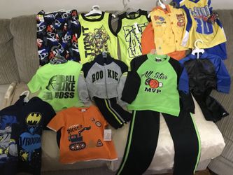 Bundle of clothes different sizes with tags