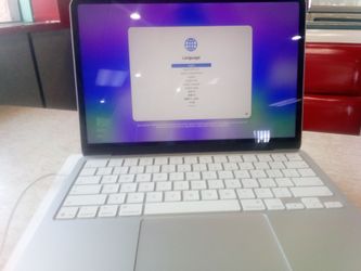 Basically BRAND NEW MACBOOK NEO (SILVER) HARDLY USED MAYBE ONCE OR TWICE