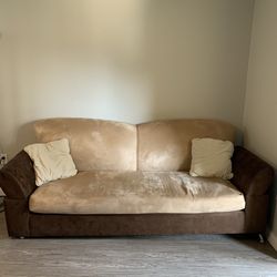 Two brown couches