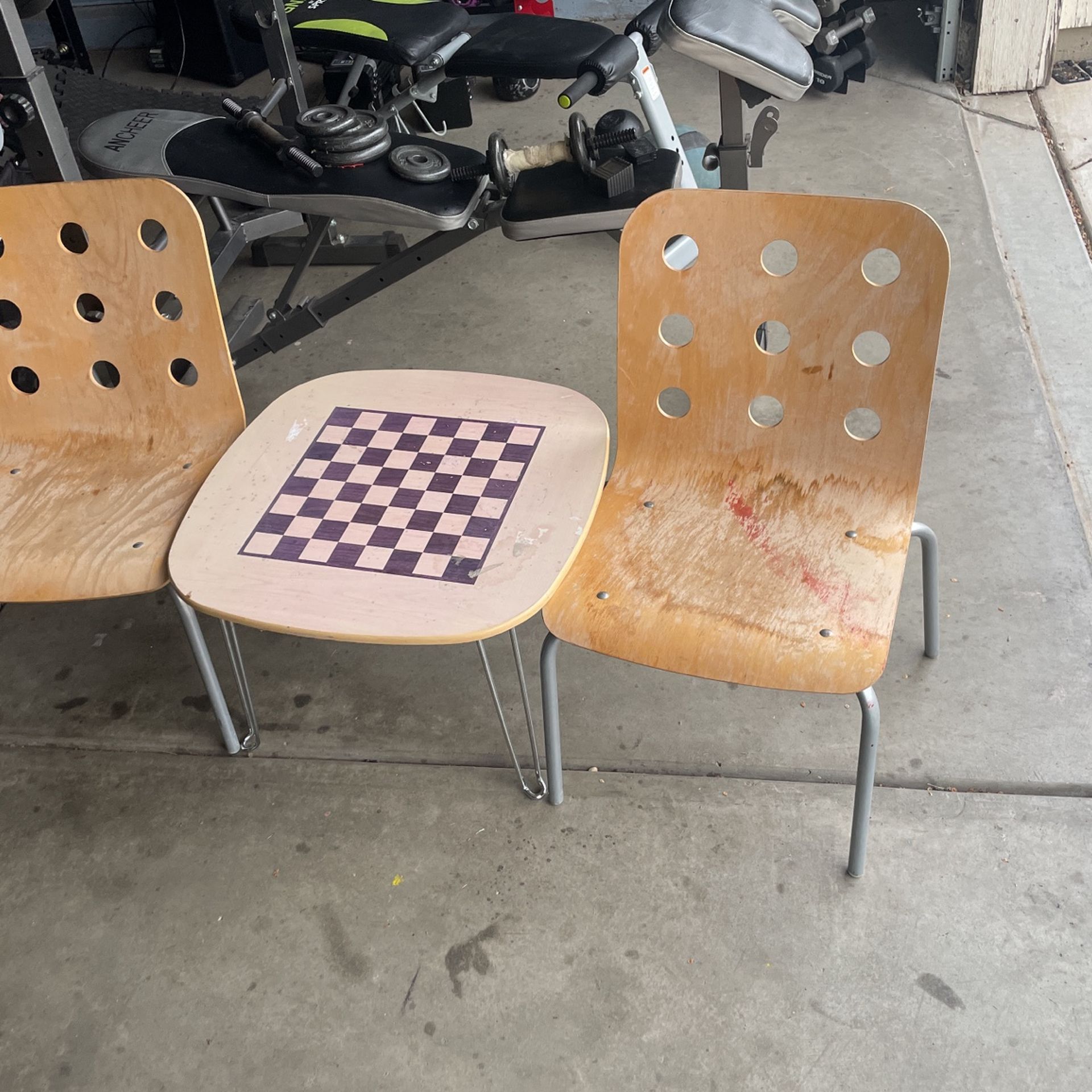 small chess table and 2 chairs