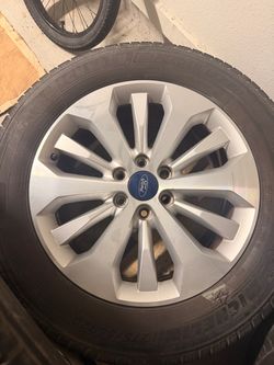 Four ford F150 20" rims with tires