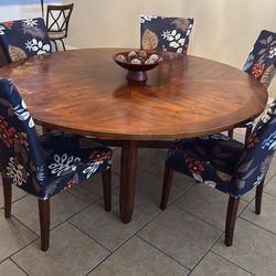 Round laminate wood table with 6 chairs