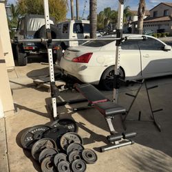 Heavy Duty Bench press/squat rack with 220lbs of Olympic weights and 7ft bar and weights tree