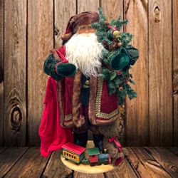 Beautiful 32” Vintage Santa Claus with wood base, wood train, teddy bear, red bag