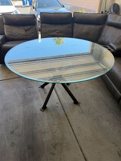 Large round glass dining table with stand , no chairs
