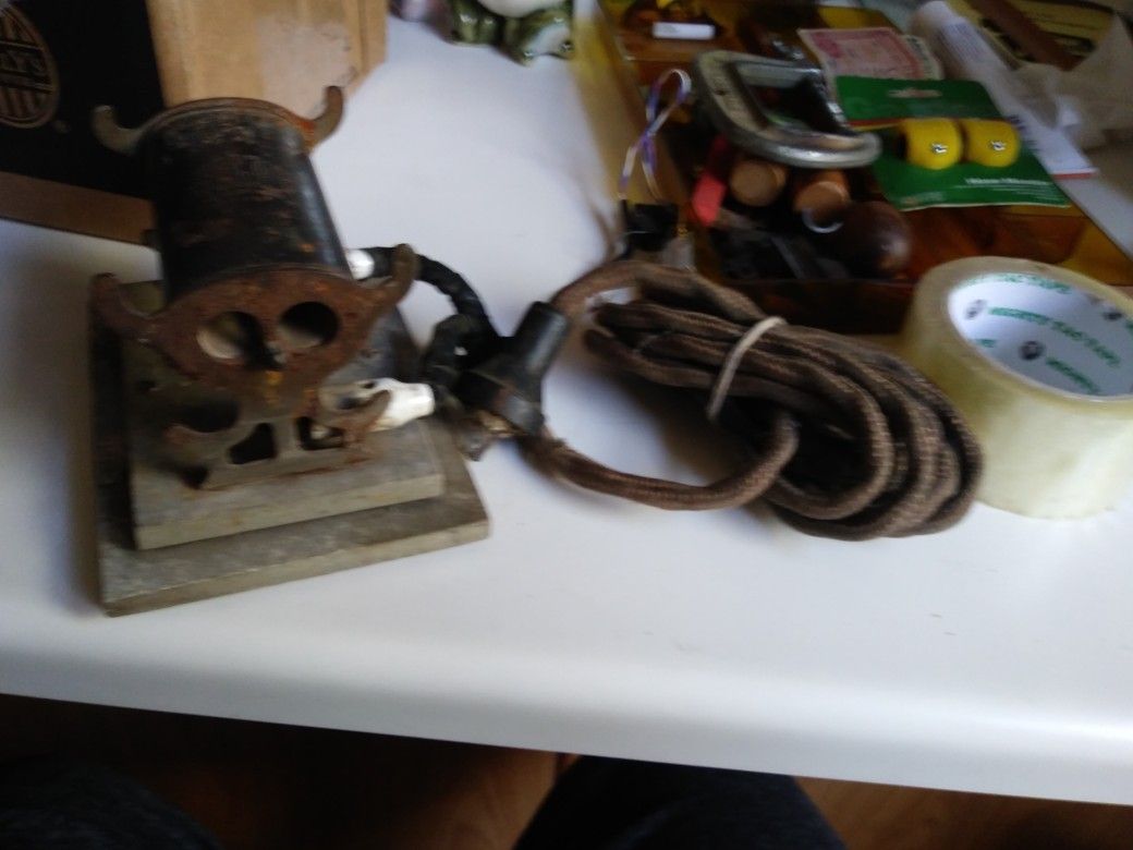 1921 Antique solar curling iron heater.