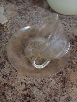 Vintage amber depression glass cup and saucer.