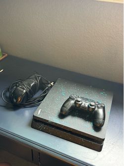PS4 with controller and cables