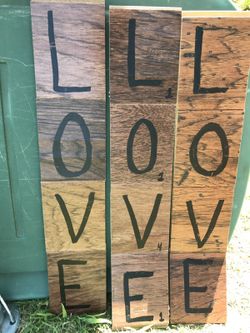 Hand made wooden LOVE sign. Each