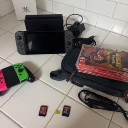 Nintendo Switch V2 With Seven Games, Extra Joy Cons, And A Carrying Bag