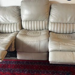 Beige couch with reclining chairs