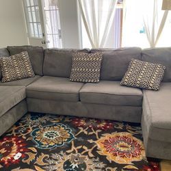 Ashley’s Furniture Sectional Couch With Pillows 