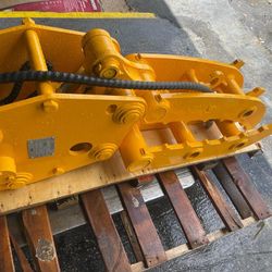 Hydraulic log grapple for mini excavator. 