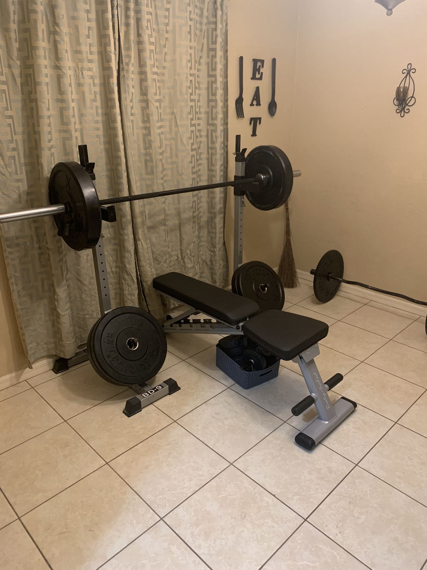 Adjustable weight bench with two adjustable racks and curved curl bar