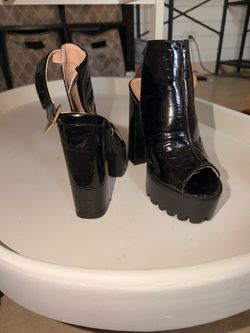 Black crocodile platform heels