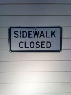 Street sign sidewalk closed