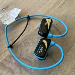 Sony waterproof 4 GB Sports MP3 Digital Player with Swimming Earbuds and charger.