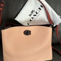 The New Purse Has The Tag  With Dustbag