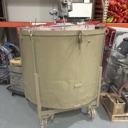 slurry mixer or an industrial vertical mixing tank on a mobile caster frame