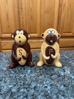 Vintage Ceramic Monkey pair of Salt and Pepper Shakers.  Size approximately 4 inches tall.  Preowned used normal use.