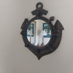 Nautical Theme Mirror Featuring An Anchor and A Ships Wheel Design .
