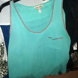 WOMEN'S SLEEVELESS SHIRT....