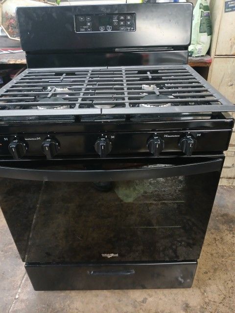 Black whirlpool five burner Stove