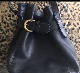 Coach black bucket Crossbody purse is 9X9 with a 20 inch adjustable drop strap great preowned condition