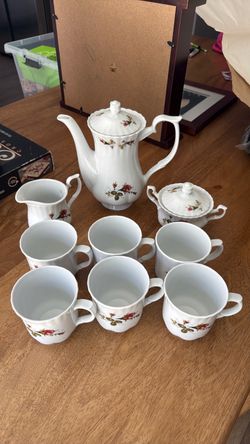 White Porcelain Tea Set with Rose Pattern
