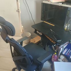 Black office chair and black wood office desk